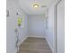 Bright laundry room features wood-look flooring, utility sink hookups, and a window for natural light at 2901 W Nassau St, Tampa, FL 33607