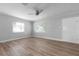 Bright living room with neutral walls, wood floors, and a ceiling fan at 2910 N 17Th St, Tampa, FL 33605