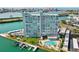 Gorgeous aerial view of the high rise with pool, boat docks and bay views at 31 Island Way # 106, Clearwater Beach, FL 33767