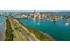Beautiful aerial view of the city with lush greenery and waterfront properties on the shore at 31 Island Way # 106, Clearwater Beach, FL 33767