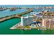 Stunning high rise aerial view showcases pristine waterfront living with easy access to the city at 31 Island Way # 106, Clearwater Beach, FL 33767