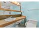 Bathroom featuring a toilet and a sink vanity against a light blue wall at 31 Island Way # 106, Clearwater Beach, FL 33767