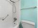 Clean bathroom with shower and tub featuring a white tile surround at 31 Island Way # 106, Clearwater Beach, FL 33767