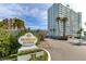 Beautiful high rise with lovely sign, landscaping and convenient covered parking area at 31 Island Way # 106, Clearwater Beach, FL 33767