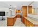 Updated kitchen with granite countertops, stainless steel appliances, and ample cabinet space at 31 Island Way # 106, Clearwater Beach, FL 33767