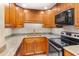 Well-equipped kitchen with ample counter space and storage, featuring modern appliances at 31 Island Way # 106, Clearwater Beach, FL 33767