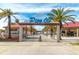 Pier 60 walkway with palm trees, kiosks, and a beachfront for a fun-filled day at 31 Island Way # 106, Clearwater Beach, FL 33767