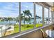 Expansive waterfront views highlighting tropical palm trees and lush landscaping at 31 Island Way # 106, Clearwater Beach, FL 33767