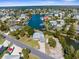 Aerial view of a charming home featuring a metal roof, surrounded by waterfront canals in a serene neighborhood at 3609 Flamingo Blvd, Hernando Beach, FL 34607