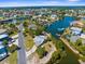 Aerial view of a charming home featuring a metal roof, surrounded by waterfront canals in a serene neighborhood at 3609 Flamingo Blvd, Hernando Beach, FL 34607