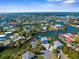 Beautiful aerial view of waterfront community with canal access, lush landscaping and stunning homes at 3609 Flamingo Blvd, Hernando Beach, FL 34607