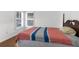 Bedroom featuring a bed and plantation shutters at 3609 Flamingo Blvd, Hernando Beach, FL 34607