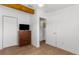 Bedroom featuring closet and dresser with television, tile floors, and ample space at 3609 Flamingo Blvd, Hernando Beach, FL 34607