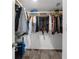 Walk-in closet with plenty of storage shelves and tile floors at 3609 Flamingo Blvd, Hernando Beach, FL 34607