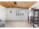 Bright dining room featuring a wooden ceiling, tiled floors, and plenty of natural light at 3609 Flamingo Blvd, Hernando Beach, FL 34607