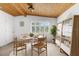 Dining area features a wooden ceiling, tiled floors, and plenty of natural light at 3609 Flamingo Blvd, Hernando Beach, FL 34607