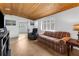 Bright living room featuring tiled floors, large window with natural light, and neutral paint at 3609 Flamingo Blvd, Hernando Beach, FL 34607