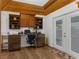 Home office with built-in desk, shelving, and a door to the outdoor area at 3609 Flamingo Blvd, Hernando Beach, FL 34607