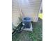 Air conditioning unit with surrounding greenery outside of home at 37324 Rose Ave, Dade City, FL 33523