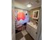 Bathroom featuring a vanity and a decorative shower curtain at 37324 Rose Ave, Dade City, FL 33523