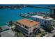 Aerial view of a condo building with waterfront access and a stunning view of the marina at 479 E Shore Dr # 8, Clearwater, FL 33767
