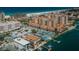 An elevated view shows waterfront condominiums, private boat docks and nearby beach and hotels at 479 E Shore Dr # 8, Clearwater, FL 33767