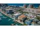 Stunning aerial view of a waterfront community featuring picturesque homes, docks, boats, and access to the open sea at 479 E Shore Dr # 8, Clearwater, FL 33767