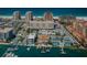 An aerial view of a coastal area showing waterfront homes, roads, parking and the beach at 479 E Shore Dr # 8, Clearwater, FL 33767