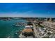 An aerial view captures a coastal city with a marina and nearby streets at 479 E Shore Dr # 8, Clearwater, FL 33767