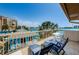 Enjoy breathtaking ocean and city views from the private balcony featuring tile flooring and comfortable lounge chairs at 479 E Shore Dr # 8, Clearwater, FL 33767