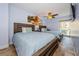 Light and bright bedroom with two beds, ceiling fan, and balcony access for seamless indoor/outdoor living at 479 E Shore Dr # 8, Clearwater, FL 33767
