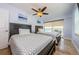Bedroom showcasing two beds, a ceiling fan, and natural light, ideal for a comfortable living space at 479 E Shore Dr # 8, Clearwater, FL 33767