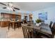 Open kitchen and dining area with breakfast bar and seating, perfect for entertaining at 479 E Shore Dr # 8, Clearwater, FL 33767