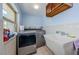 Practical laundry room with a washing machine, sink, and ample counter space at 479 E Shore Dr # 8, Clearwater, FL 33767