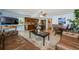 Spacious living room flows into kitchen with breakfast bar, offering ample seating and entertainment space at 479 E Shore Dr # 8, Clearwater, FL 33767