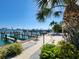Waterfront patio and entertainment area with seating and views of the harbor, boats, and docks at 479 E Shore Dr # 8, Clearwater, FL 33767