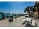 Lush waterfront patio and entertainment area with a picnic table, seating, and views of the harbor at 479 E Shore Dr # 8, Clearwater, FL 33767