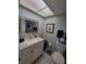 Bright bathroom featuring a vanity with framed mirror and a shower with patterned curtain at 4895 Bay Ne St # 311, St Petersburg, FL 33703