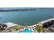 Beautiful aerial view of a bay with a pool, spa and boat dock in a condominium complex at 5220 Brittany S Dr # 309, St Petersburg, FL 33715