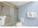Bathroom featuring a modern sink, vanity, and a shower with a sliding glass door at 5220 Brittany S Dr # 309, St Petersburg, FL 33715