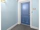 A view of the unit entry door featuring neutral paint and new hardware at 5220 Brittany S Dr # 309, St Petersburg, FL 33715