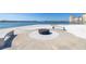 Modern fire pit area with seating, perfect for evening gatherings by the water at 5220 Brittany S Dr # 309, St Petersburg, FL 33715