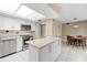 Kitchen with stainless steel appliances, tile flooring, and a skylight at 5220 Brittany S Dr # 309, St Petersburg, FL 33715