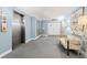 Lobby area with elevators, artwork and seating creating a welcoming and modern space at 5220 Brittany S Dr # 309, St Petersburg, FL 33715