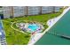 Wonderful drone image showing waterfront condominium with community pool, lounge chairs, and boat docks at 5220 Brittany S Dr # 309, St Petersburg, FL 33715