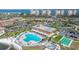 Aerial view of community pool, shuffleboard, boat dock and outdoor grilling area on the water at 5220 Brittany S Dr # 309, St Petersburg, FL 33715