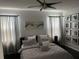 Modern bedroom showcasing a comfortable bed, soft lighting, and artistic wall decor at 5229 Clover Mist Dr, Apollo Beach, FL 33572