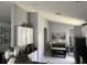 Stylish kitchen with granite counters, white cabinets, and stainless steel appliances, opening to a dining and living area at 5229 Clover Mist Dr, Apollo Beach, FL 33572