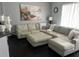 Comfortable living room features a sectional sofa with throw pillows, and an art piece, perfect for relaxing at 5229 Clover Mist Dr, Apollo Beach, FL 33572