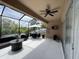 Expansive screened patio with seating area, providing privacy and outdoor living space at 5229 Clover Mist Dr, Apollo Beach, FL 33572